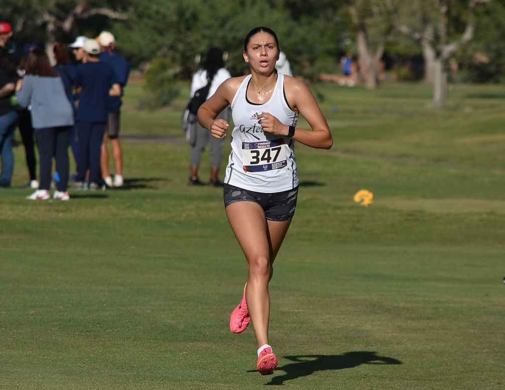 Sophomore Sofia Cambridge (Page HS) was the top finisher for the Aztecs in the 6K open race at the Highlander Invitational as she finished with a personal-best time of 24:19.8. The Aztecs took eighth place with a total of 190 points as four of the five team scoring runners set new PRs. Photo by Ben Carbajal